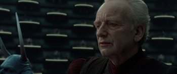Movie still from “Star Wars: Episode II - Attack of the Clones” (2002), directed by George Lucas – An old man with a bald head looking into the distance; Close Up shot, Over the shoulder angle