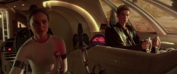 Movie still from “Star Wars: Episode II - Attack of the Clones” (2002), directed by George Lucas – A woman sitting in a car with a steering wheel; Medium shot, Over the shoulder angle
