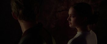 Movie still from “Star Wars: Episode II - Attack of the Clones” (2002), directed by George Lucas – A man and a woman are looking at each other in the dark; Close Up shot, Over the shoulder angle