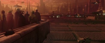 Movie still from “Star Wars: Episode II - Attack of the Clones” (2002), directed by George Lucas – Two people are sitting on a wall looking at a city; Extreme Wide shot, High angle
