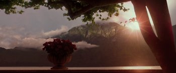 Movie still from “Star Wars: Episode II - Attack of the Clones” (2002), directed by George Lucas – A vase of flowers sitting on a table under a tree; Extreme Wide shot, Low angle