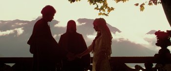 Movie still from “Star Wars: Episode II - Attack of the Clones” (2002), directed by George Lucas – A bride and groom holding hands at a wedding ceremony; Wide shot, Low angle
