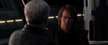 Movie still from “Star Wars: Episode III - Revenge of the Sith” (2005), directed by George Lucas – A man in a black shirt is looking at another man; Close Up shot, Over the shoulder angle