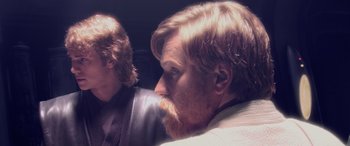 Movie still from “Star Wars: Episode III - Revenge of the Sith” (2005), directed by George Lucas – A man with red hair and a goatee looks into a mirror; Close Up shot, Over the shoulder angle