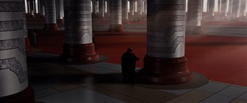 Movie still from “Star Wars: Episode III - Revenge of the Sith” (2005), directed by George Lucas – A person sitting on a chair in front of pillars; Extreme Wide shot, High angle
