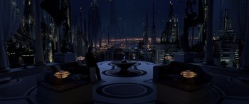 Movie still from “Star Wars: Episode III - Revenge of the Sith” (2005), directed by George Lucas – A man standing in front of a fountain in a city at night; Extreme Wide shot, High angle