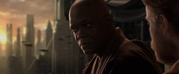 Movie still from “Star Wars: Episode III - Revenge of the Sith” (2005), directed by George Lucas – A bald man with a towel around his neck; Close Up shot, Over the shoulder angle