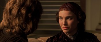 Movie still from “Star Wars: Episode III - Revenge of the Sith” (2005), directed by George Lucas – A person wearing a headpiece; Close Up shot, Over the shoulder angle