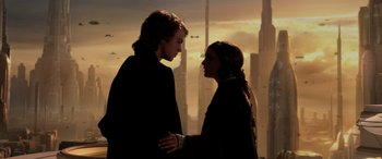 Movie still from “Star Wars: Episode III - Revenge of the Sith” (2005), directed by George Lucas – Two people standing next to each other in front of a city skyline; Close Up shot, Low angle