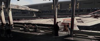 Movie still from “Star Wars: Episode III - Revenge of the Sith” (2005), directed by George Lucas – Two people are standing in front of a building; Extreme Wide shot, High angle