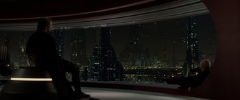 Movie still from “Star Wars: Episode III - Revenge of the Sith” (2005), directed by George Lucas – A person sitting in front of a window at night; Wide shot, High angle