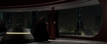 Movie still from “Star Wars: Episode III - Revenge of the Sith” (2005), directed by George Lucas – A woman dressed in a red robe standing in front of a window; Wide shot, High angle