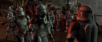 Movie still from “Star Wars: Episode III - Revenge of the Sith” (2005), directed by George Lucas – A group of star wars stormtroopers standing next to each other; Wide shot, High angle