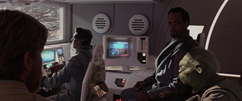 Movie still from “Star Wars: Episode III - Revenge of the Sith” (2005), directed by George Lucas – Two men sitting next to each other in front of a computer screen; Medium shot, Over the shoulder angle