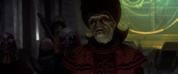 Movie still from “Star Wars: Episode III - Revenge of the Sith” (2005), directed by George Lucas – A person wearing a costume; Medium shot, Over the shoulder angle