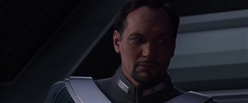 Movie still from “Star Wars: Episode III - Revenge of the Sith” (2005), directed by George Lucas – A person wearing a suit; Close Up shot, Low angle