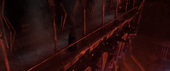 Movie still from “Star Wars: Episode III - Revenge of the Sith” (2005), directed by George Lucas – A person in a hooded cloak standing in a dark room; Extreme Wide shot, Overhead angle