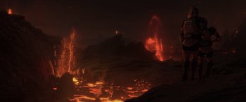 Movie still from “Star Wars: Episode III - Revenge of the Sith” (2005), directed by George Lucas – A lava flow in the night time with a fire in the background; Extreme Wide shot, High angle
