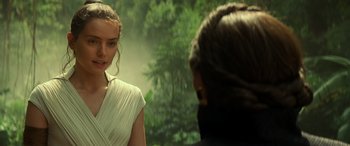 Movie still from “Star Wars: Episode IX - The Rise of Skywalker” (2019), directed by J.J. Abrams – A woman in a white dress and a man in a black jacket; Close Up shot, Over the shoulder angle