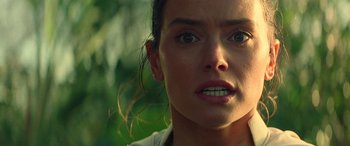 Movie still from “Star Wars: Episode IX - The Rise of Skywalker” (2019), directed by J.J. Abrams – A woman's face in a forest setting; Close Up shot, Over the shoulder angle