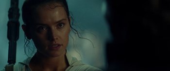 Movie still from “Star Wars: Episode IX - The Rise of Skywalker” (2019), directed by J.J. Abrams – A woman's face in the dark; Close Up shot, Over the shoulder angle