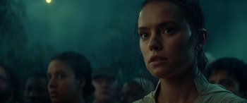 Movie still from “Star Wars: Episode IX - The Rise of Skywalker” (2019), directed by J.J. Abrams – A person looking at the camera; Close Up shot, Over the shoulder angle