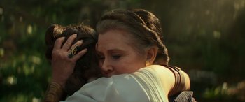 Movie still from “Star Wars: Episode IX - The Rise of Skywalker” (2019), directed by J.J. Abrams – A woman is hugging a monkey in a forest; Close Up shot, Over the shoulder angle