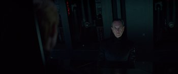 Movie still from “Star Wars: Episode IX - The Rise of Skywalker” (2019), directed by J.J. Abrams – A man in a black shirt is looking at a computer screen; Medium shot, Over the shoulder angle