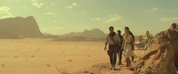 Movie still from “Star Wars: Episode IX - The Rise of Skywalker” (2019), directed by J.J. Abrams – A group of people walking across a desert; Wide shot, Low angle