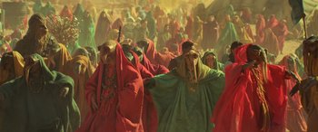 Movie still from “Star Wars: Episode IX - The Rise of Skywalker” (2019), directed by J.J. Abrams – A group of people dressed in colorful robes; Wide shot, High angle