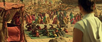 Movie still from “Star Wars: Episode IX - The Rise of Skywalker” (2019), directed by J.J. Abrams – A group of people sitting under a tree; Extreme Wide shot, High angle