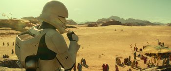 Movie still from “Star Wars: Episode IX - The Rise of Skywalker” (2019), directed by J.J. Abrams – A person in a costume in the desert; Medium shot, Over the shoulder angle