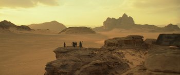 Movie still from “Star Wars: Episode IX - The Rise of Skywalker” (2019), directed by J.J. Abrams – A group of people standing on top of a cliff; Extreme Wide shot, High angle