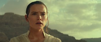 Movie still from “Star Wars: Episode IX - The Rise of Skywalker” (2019), directed by J.J. Abrams – A person wearing a white shirt; Close Up shot, Over the shoulder angle