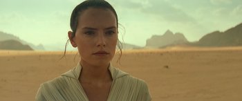 Movie still from “Star Wars: Episode IX - The Rise of Skywalker” (2019), directed by J.J. Abrams – A person wearing a white shirt; Close Up shot, Over the shoulder angle