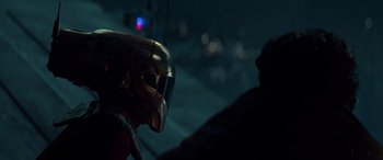 Movie still from “Star Wars: Episode IX - The Rise of Skywalker” (2019), directed by J.J. Abrams – A person wearing a iron man helmet; Close Up shot, Over the shoulder angle