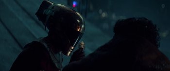 Movie still from “Star Wars: Episode IX - The Rise of Skywalker” (2019), directed by J.J. Abrams – A man holding a watch in his hand; Close Up shot, Over the shoulder angle