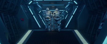 Movie still from “Star Wars: Episode IX - The Rise of Skywalker” (2019), directed by J.J. Abrams – A couple of men in white suits walking down a ramp; Wide shot, Low angle