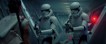 Movie still from “Star Wars: Episode IX - The Rise of Skywalker” (2019), directed by J.J. Abrams – A couple of people that are standing up in a room; Medium shot, Low angle