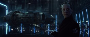 Movie still from “Star Wars: Episode IX - The Rise of Skywalker” (2019), directed by J.J. Abrams – A man standing in front of a spaceship; Close Up shot, Low angle