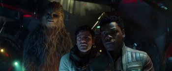 Movie still from “Star Wars: Episode IX - The Rise of Skywalker” (2019), directed by J.J. Abrams – Two men and a woman are standing next to each other; Close Up shot, Low angle