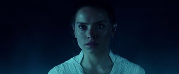 Movie still from “Star Wars: Episode IX - The Rise of Skywalker” (2019), directed by J.J. Abrams – A person wearing a white shirt; Close Up shot, Over the shoulder angle