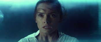 Movie still from “Star Wars: Episode IX - The Rise of Skywalker” (2019), directed by J.J. Abrams – A person wearing a white shirt; Close Up shot, Low angle