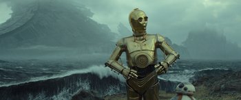 Movie still from “Star Wars: Episode IX - The Rise of Skywalker” (2019), directed by J.J. Abrams – A star wars c - 3 p 0 standing in front of waves; Medium shot, Low angle