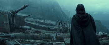 Movie still from “Star Wars: Episode IX - The Rise of Skywalker” (2019), directed by J.J. Abrams – A man standing on top of a hill looking at the sky; Medium shot, Low angle