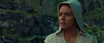 Movie still from “Star Wars: Episode IX - The Rise of Skywalker” (2019), directed by J.J. Abrams – A person wearing a hooded shirt; Close Up shot, Over the shoulder angle