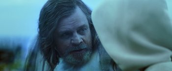 Movie still from “Star Wars: Episode IX - The Rise of Skywalker” (2019), directed by J.J. Abrams – A man with long hair and a beard looking into a mirror; Close Up shot, Over the shoulder angle