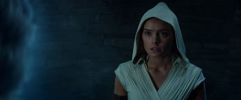 Movie still from “Star Wars: Episode IX - The Rise of Skywalker” (2019), directed by J.J. Abrams – A woman in a white robe and a white hood; Close Up shot, Over the shoulder angle