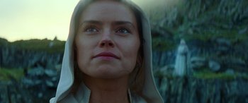 Movie still from “Star Wars: Episode IX - The Rise of Skywalker” (2019), directed by J.J. Abrams – A person wearing a hooded sweatshirt; Close Up shot, Low angle