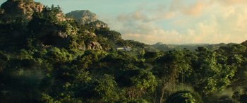 Movie still from “Star Wars: Episode IX - The Rise of Skywalker” (2019), directed by J.J. Abrams – A helicopter flying over a lush green forest; Extreme Wide shot, High angle